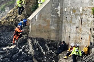 A couple and their dog were rescued in Tenby after being trapped by an incoming tide. Lifeboat, coastguard, and helicopter teams ensured their safe escape.