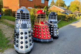 Doctor Who superfan Mark Casto builds lifesize Daleks to delight locals and support charity events, combining his graphic design skills with a lifelong passion for the show.