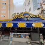 While Wetherspoons has removed steaks from 40 UK pubs, Witherspoons in Pattaya, Thailand, continues to serve juicy steaks and affordable drinks, attracting Brits abroad.