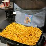 Fast food fans in Spain go wild as KFC's free fries promotion sparks suitcase-stuffing frenzy, compensating for old chips with 2.41kg of crispy, upgraded potatoes per customer!