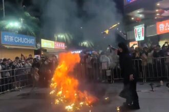 Fire breather's flaming sword stunt goes wrong in Fujian, China, setting a spectator ablaze. Viral video sparks laughs and debates on safety and blade quality.