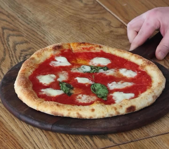 Gordon Ramsay faces backlash over his £13.50 margherita pizza, criticized by fans for its lack of cheese and 'floppy' structure, sparking debate online about its quality.