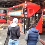 A London bus driver smashed a window after misjudging a turn near The Shard, sparking debate over blame. Locals criticized bystanders for filming instead of helping.