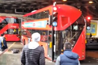 A London bus driver smashed a window after misjudging a turn near The Shard, sparking debate over blame. Locals criticized bystanders for filming instead of helping.