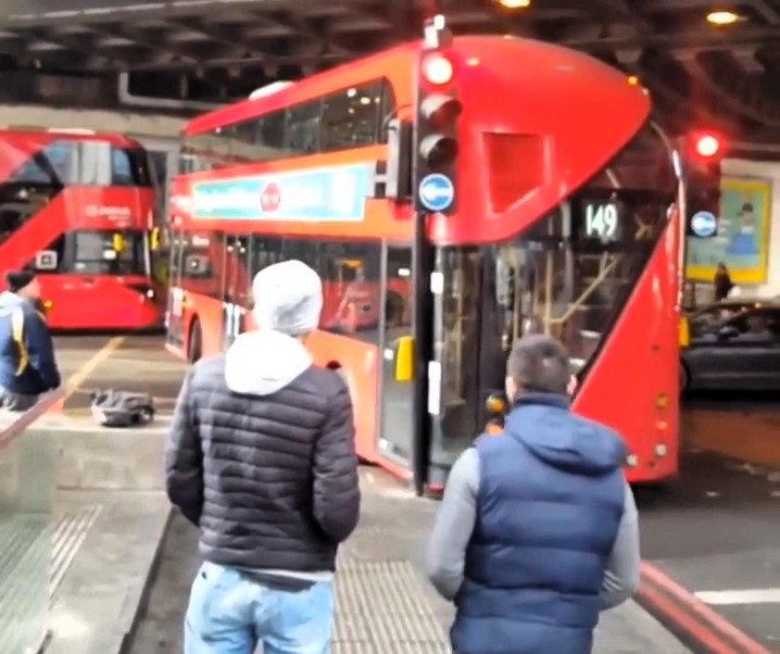 A London bus driver smashed a window after misjudging a turn near The Shard, sparking debate over blame. Locals criticized bystanders for filming instead of helping.