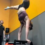 Gym-goer hilariously fails at a handstand after critiquing a friend’s 'bad form.' Viral TikTok with 15M views shows the playful moment, sparking laughter and camaraderie.