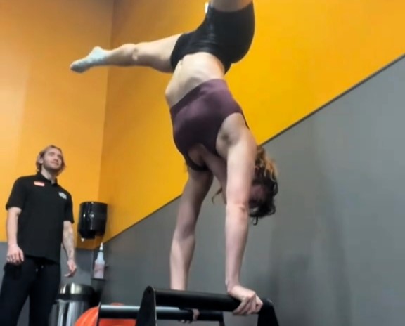 Gym-goer hilariously fails at a handstand after critiquing a friend’s 'bad form.' Viral TikTok with 15M views shows the playful moment, sparking laughter and camaraderie.