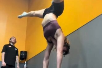 Gym-goer hilariously fails at a handstand after critiquing a friend’s 'bad form.' Viral TikTok with 15M views shows the playful moment, sparking laughter and camaraderie.