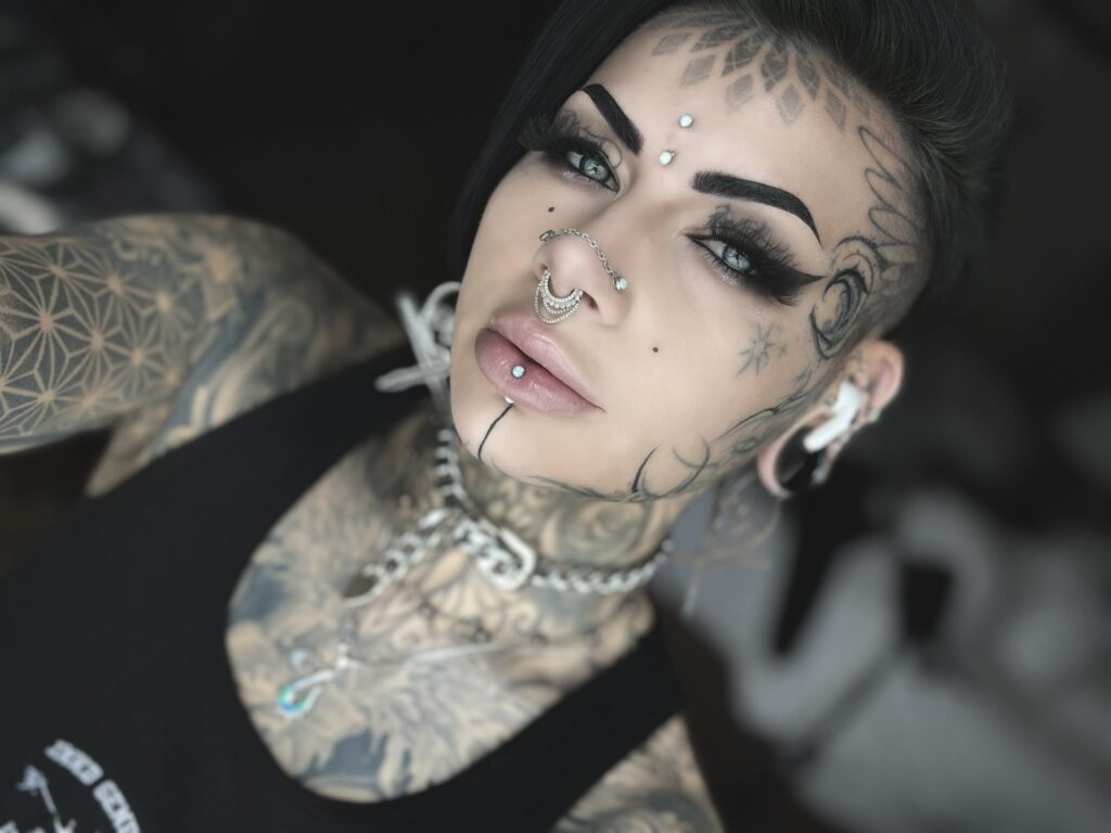 A tattoo artist, known as Brookelle Bombshelle, has spent over £10,000 on 160 tattoos, ignoring public stares and family questions, as she works toward a full body suit.