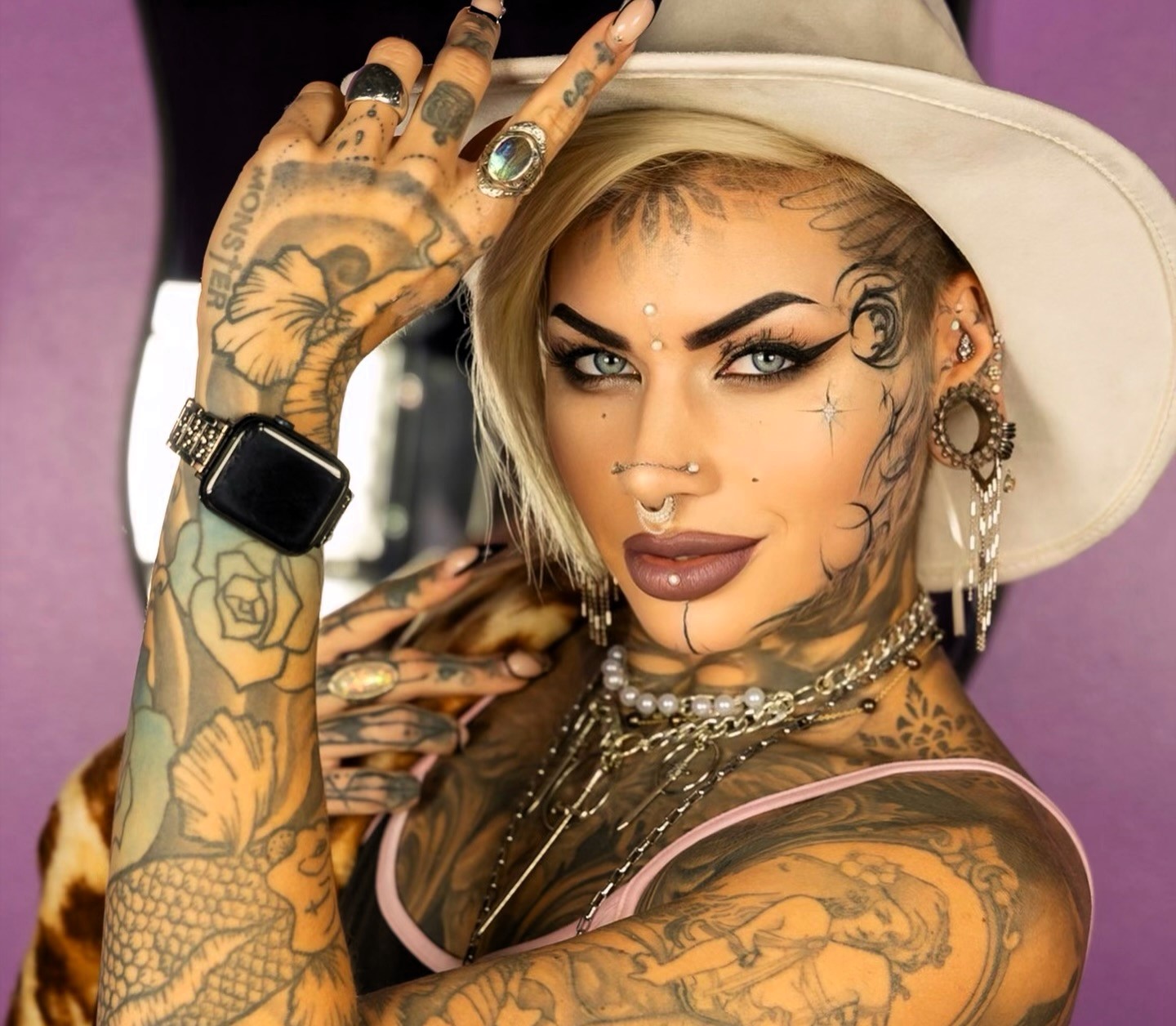 A tattoo artist, known as Brookelle Bombshelle, has spent over £10,000 on 160 tattoos, ignoring public stares and family questions, as she works toward a full body suit.