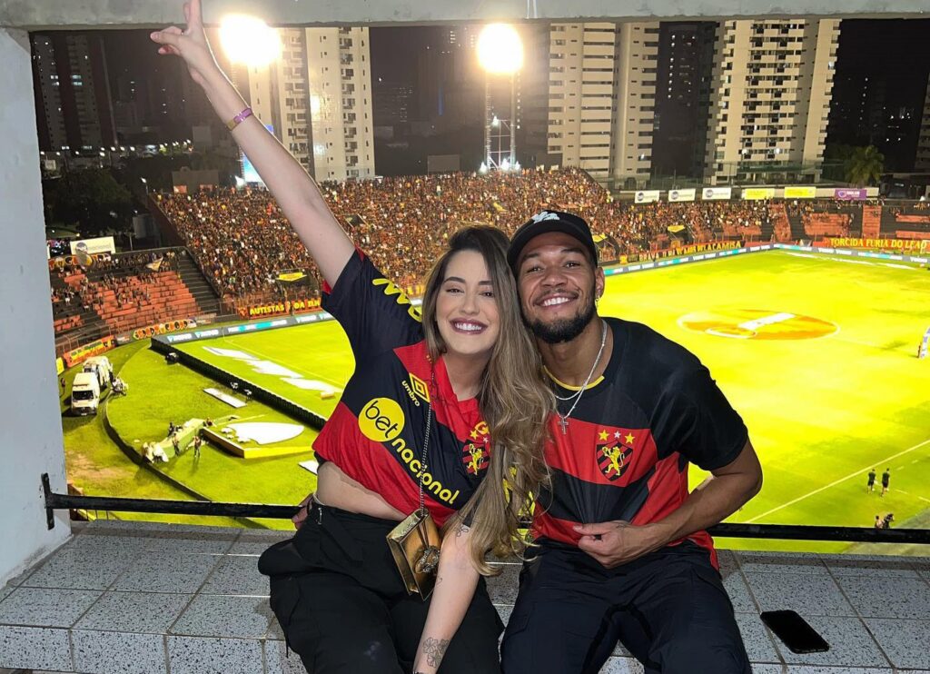 Newcastle star Joelinton's wife, Thays Gondim, proudly sports his 'Big Joe' nickname tattoo on her arm, sparking fan reactions from admiration to playful cringes.