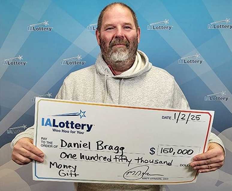 Lottery winner drives his "rusty" 2001 Chevrolet Suburban with 849,000 miles through a snowstorm to claim £122k prize, planning a "major upgrade" to a new pickup truck.