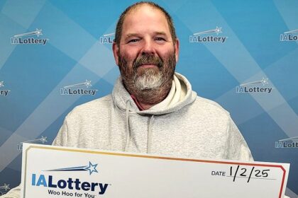 Lottery winner drives his "rusty" 2001 Chevrolet Suburban with 849,000 miles through a snowstorm to claim £122k prize, planning a "major upgrade" to a new pickup truck.