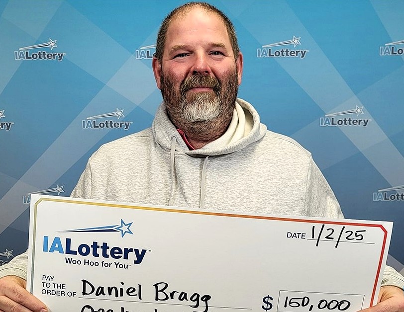 Lottery winner drives his "rusty" 2001 Chevrolet Suburban with 849,000 miles through a snowstorm to claim £122k prize, planning a "major upgrade" to a new pickup truck.