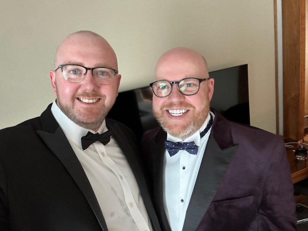 A married couple with bald heads, ginger beards, and matching glasses are often mistaken for brothers. Their TikTok explanation has racked up over 224,000 views!