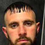 A mechanic's DIY haircut turned into a disaster when his hairdresser girlfriend, using beard clippers without a guard, left him with a mushroom-shaped trim, forcing him to go bald.