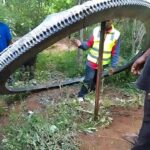 A half-tonne space ring landed in Mukuku, Kenya, baffling locals. Believed to be rocket debris, the Kenya Space Agency secured it, confirming no injuries occurred.