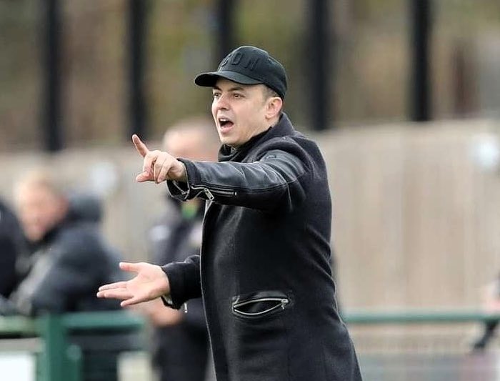 Dorking Wanderers' manager Marc White is retiring his "lucky" trenchcoat after 25 years, 1,000 matches, and 12 promotions. The iconic coat will be gifted to a fan this weekend.