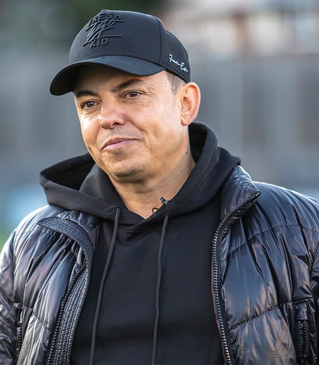 Dorking Wanderers' manager Marc White is retiring his "lucky" trenchcoat after 25 years, 1,000 matches, and 12 promotions. The iconic coat will be gifted to a fan this weekend.