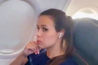 A plane passenger, praised for refusing to swap seats with a toddler, is considering legal action after being filmed and criticized by the child’s mother during a flight.