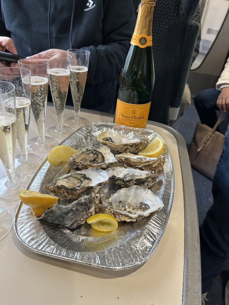 Fulham fans were mocked for enjoying oysters and champagne on a train to Leicester, embodying their club's posh reputation, as they celebrated a 2-0 victory.