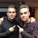 Robbie Williams impersonator Tony Lewis is booked until 2026 after the pop star's biopic "Better Man" hit cinemas, sparking global demand for his tribute performances.