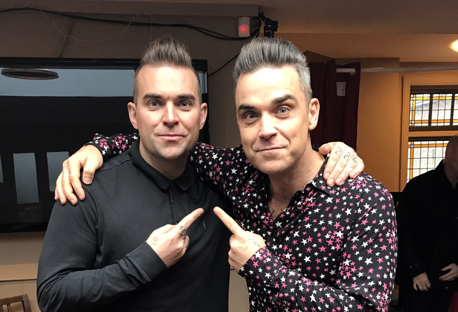 Robbie Williams impersonator Tony Lewis is booked until 2026 after the pop star's biopic "Better Man" hit cinemas, sparking global demand for his tribute performances.