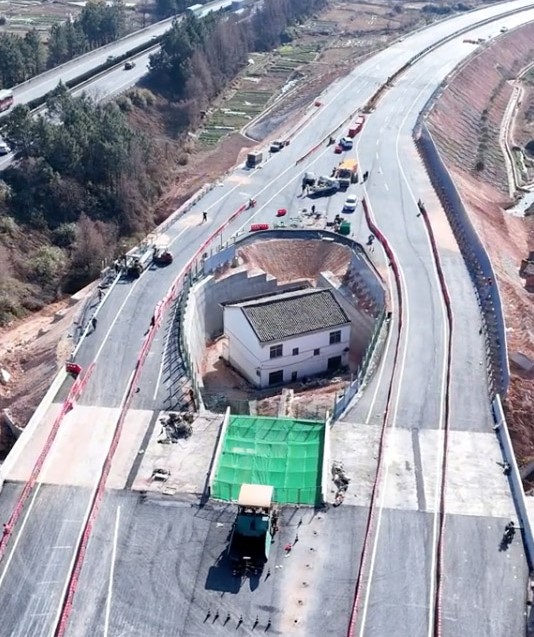 "Strongest nail house" owner regrets defying Chinese authorities after motorway is built around his home, leaving him isolated and facing an uncertain future.