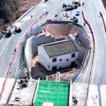 "Strongest nail house" owner regrets defying Chinese authorities after motorway is built around his home, leaving him isolated and facing an uncertain future.