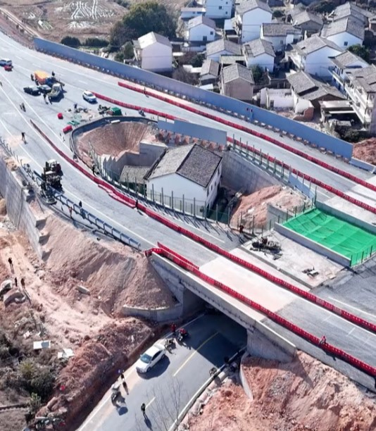 "Strongest nail house" owner regrets defying Chinese authorities after motorway is built around his home, leaving him isolated and facing an uncertain future.