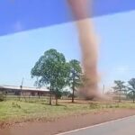 A towering dust devil ripped through a roadside in Gobernador Virasoro, Argentina, startling locals. Unlike tornadoes, these whirlwinds spiral upward from hot ground air.