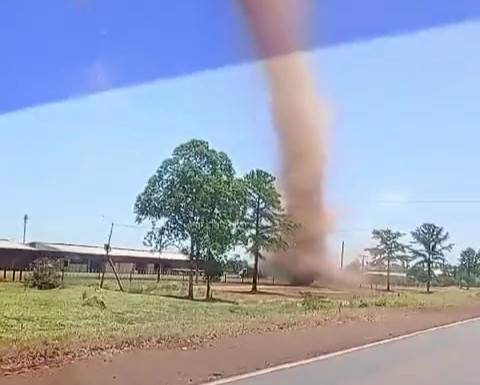 A towering dust devil ripped through a roadside in Gobernador Virasoro, Argentina, startling locals. Unlike tornadoes, these whirlwinds spiral upward from hot ground air.