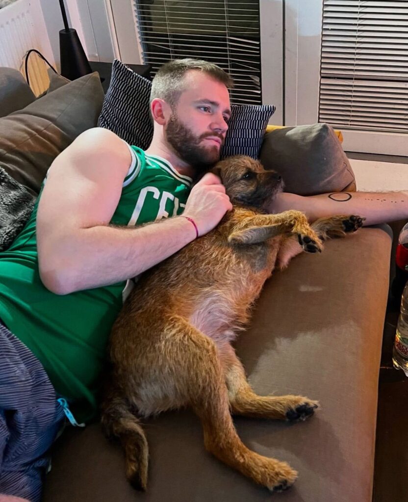 A devoted dog owner spends £500 a month on his Border Terrier, Bruce, including holidays abroad, £160 grooming sessions, and an £800 birthday party, calling him his "pride and joy."