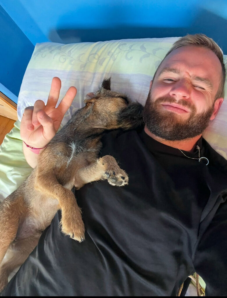 A devoted dog owner spends £500 a month on his Border Terrier, Bruce, including holidays abroad, £160 grooming sessions, and an £800 birthday party, calling him his "pride and joy."