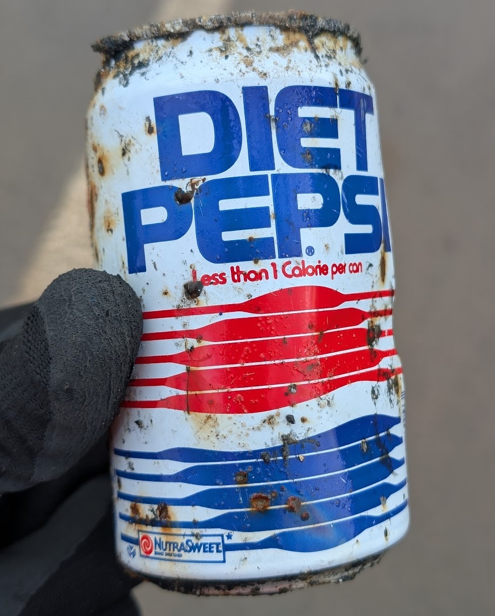 A 160-year-old beer bottle was discovered by litter pickers near the River Witham in Grantham, highlighting how long waste lingers alongside cans from the 1970s and 1980s.