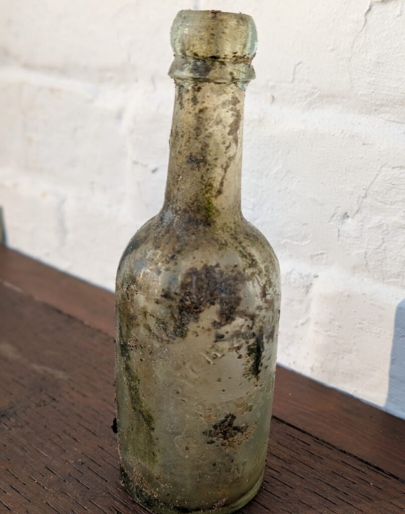 A 160-year-old beer bottle was discovered by litter pickers near the River Witham in Grantham, highlighting how long waste lingers alongside cans from the 1970s and 1980s.