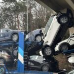 A lorry driver misjudges the height of a car transporter, crushing multiple vehicles under a Swindon overpass, leaving social media users in shock and amusement.