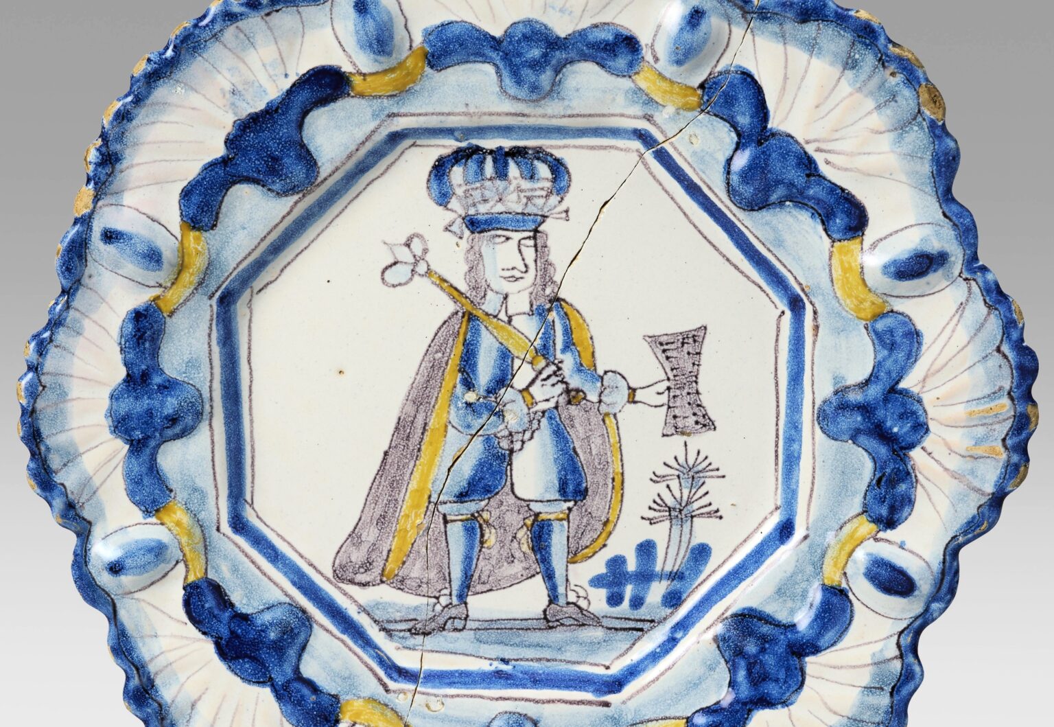 Two rare 17th-century Delftware plates, once carried to Antiques Roadshow in a handbag, have sold for over £20,000 despite one being broken in half.