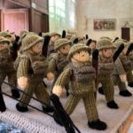 A knitted D-Day exhibition, The Longest Yarn, was canceled in Norwich over safety concerns, but will now be displayed at Peterborough Cathedral in March.