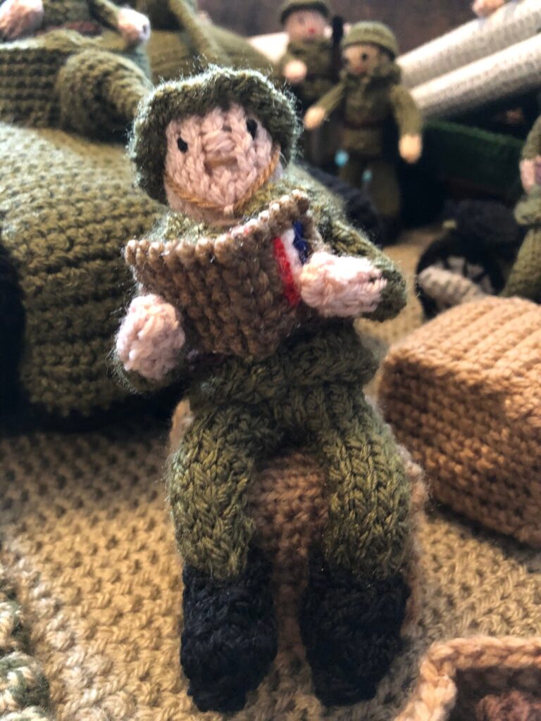 A knitted D-Day exhibition, The Longest Yarn, was canceled in Norwich over safety concerns, but will now be displayed at Peterborough Cathedral in March.