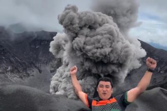 A travel vlogger captured jaw-dropping footage of Mount Dukono erupting up close - as fiery rocks and thick smoke filled the sky in Indonesia.