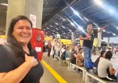 A devoted husband surprised his wife at a busy bus station on their anniversary, declaring his love in front of commuters before sharing a heartfelt embrace and kiss.