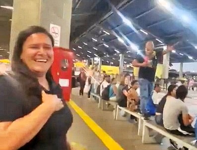 A devoted husband surprised his wife at a busy bus station on their anniversary, declaring his love in front of commuters before sharing a heartfelt embrace and kiss.