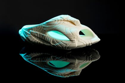 A startup has unveiled AI-designed, 3D-printed shoes resembling Crocs, promising a faster market turnaround and full recyclability, but at a premium price of $149.99.