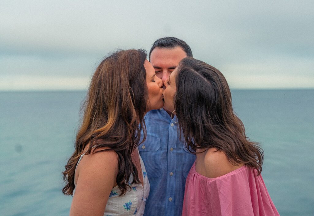 A married couple embraces polyamory after 20 years, welcoming a third partner despite initial skepticism, and now share a committed life as a throuple.