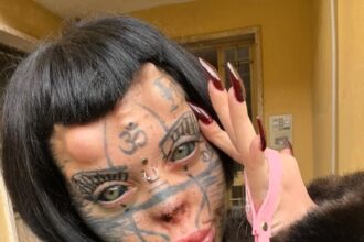 Aydin Mod, a 23-year-old model and circus performer, is transforming into a "human zombie cat" through extreme body modifications, including nose removal and scarification.