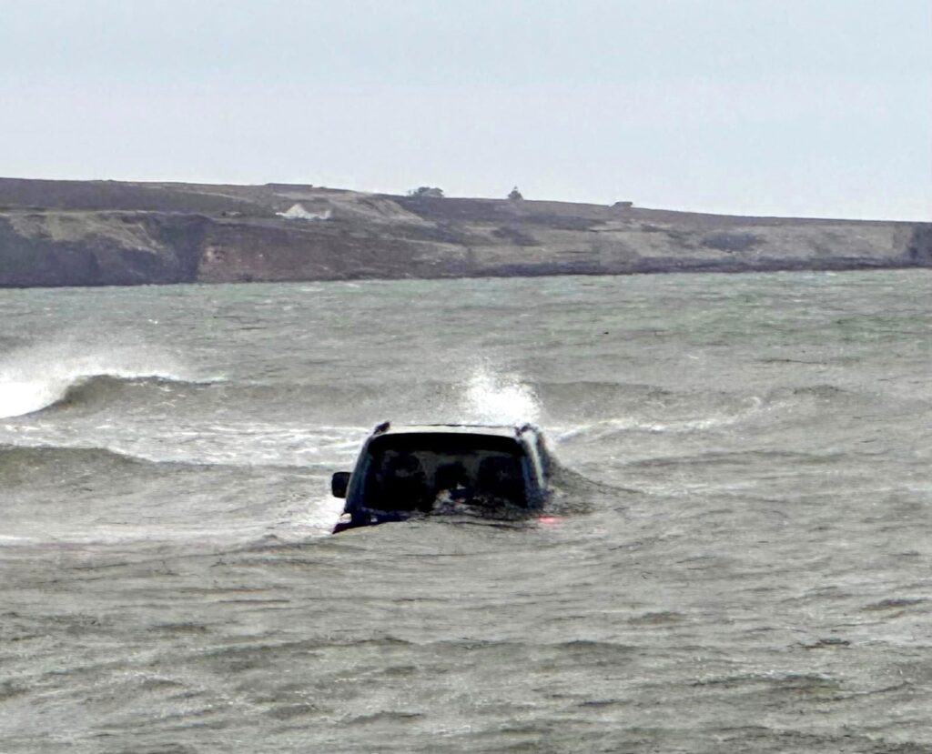 A driver has been slammed for getting their 4x4 stuck on Scotland's protected Lunan Bay beach, where it was engulfed by the tide, sparking outrage from locals.