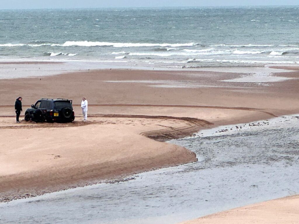 A driver has been slammed for getting their 4x4 stuck on Scotland's protected Lunan Bay beach, where it was engulfed by the tide, sparking outrage from locals.