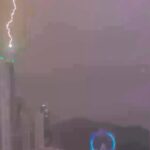 A lightning bolt struck the 770ft Infinity Coast skyscraper in Balneário Camboriú, Brazil, during a storm, causing no damage but leaving many locals without power overnight.