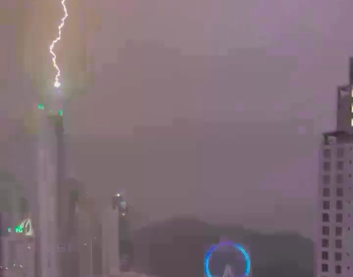 A lightning bolt struck the 770ft Infinity Coast skyscraper in Balneário Camboriú, Brazil, during a storm, causing no damage but leaving many locals without power overnight.